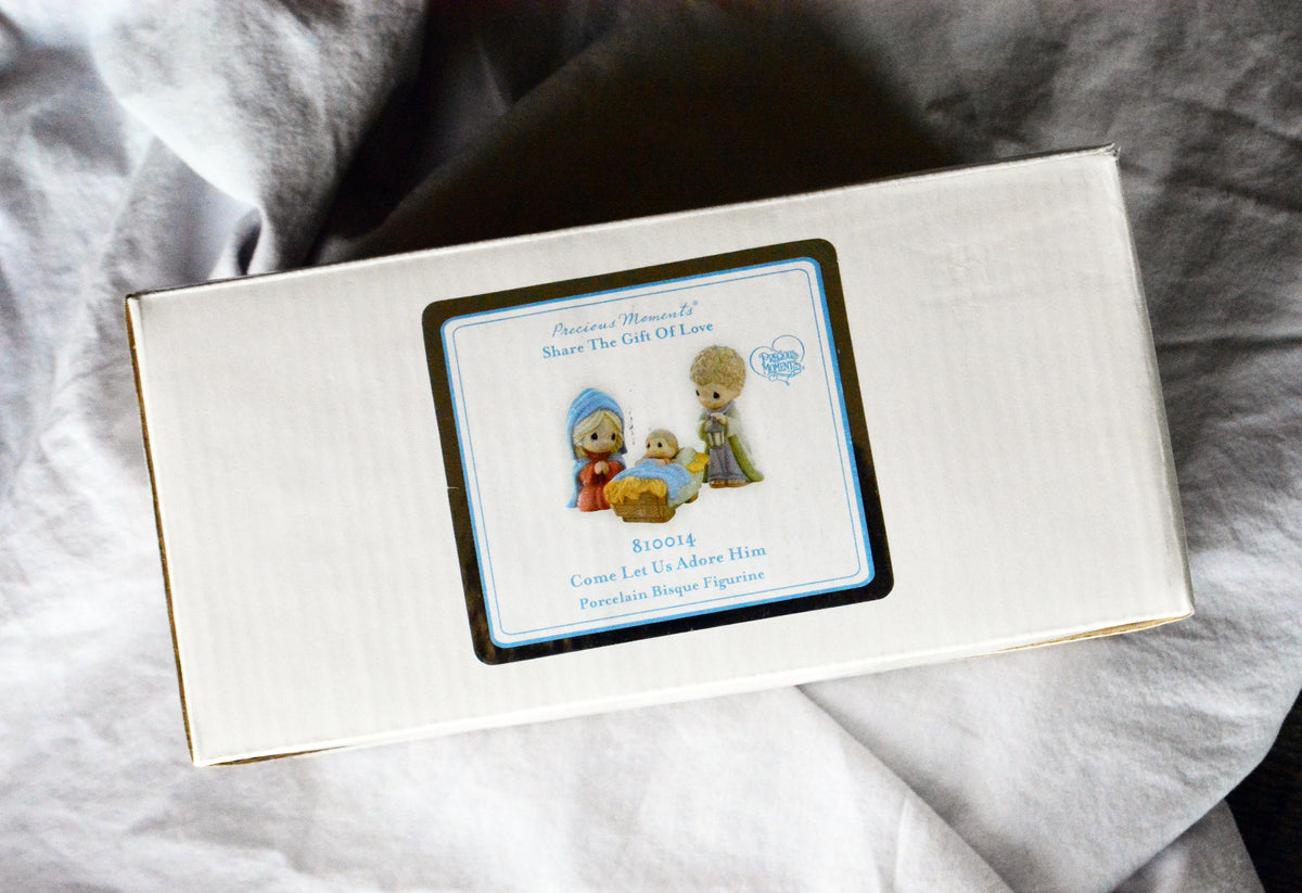 Precious Moments Come Let Us Adore Him three-piece nativity set in original box.