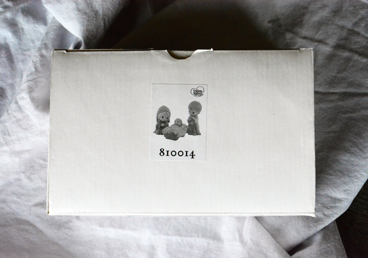 Precious Moments Come Let Us Adore Him three-piece nativity set in original box.